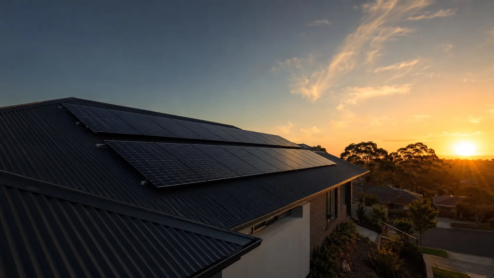 Australian home roof with solar panels at sunset